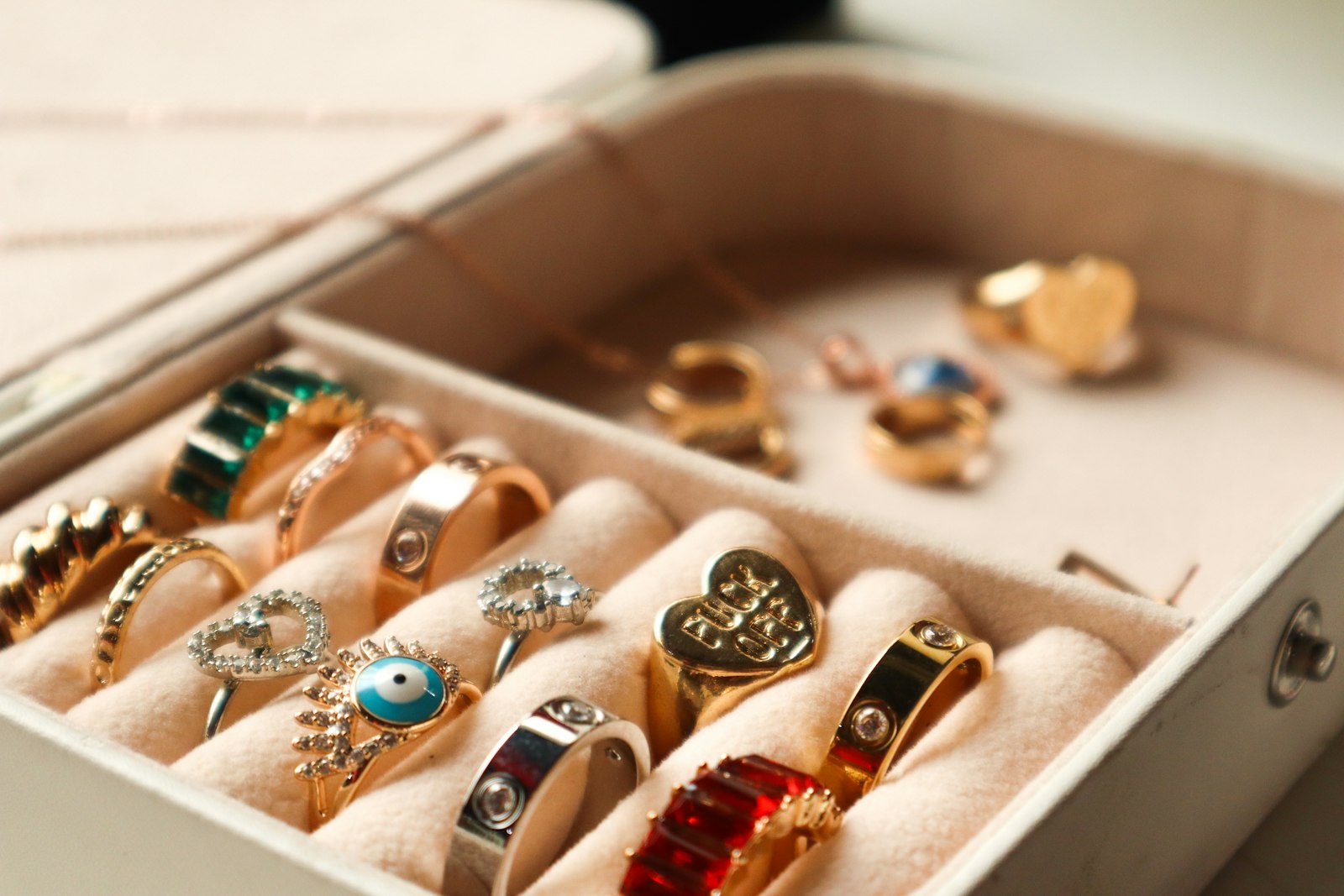 Rings arranged in a cream jewellery box