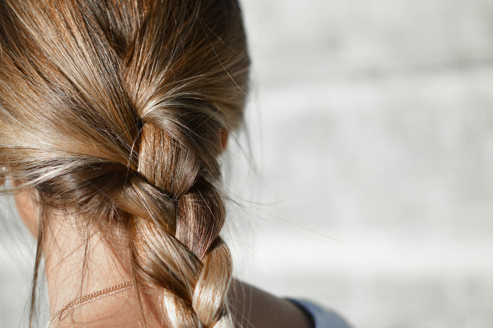A loose braid in long, light brown hair